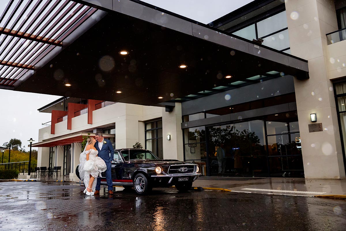 bride and groom with mustang for wedding photos at kooindah waters